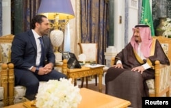Saudi Arabia's King Salman bin Abdulaziz Al Saud meets with former Lebanese Prime Minister Saad al-Hariri in Riyadh, Saudi Arabia, Nov. 6, 2017.