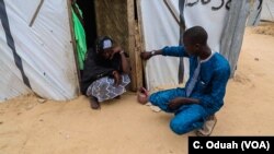A mother and son reunite in an internally displaced persons camp after years of being separated. The young man has been released from the nearby military barracks where he was detained upon suspicion of having links with Boko Haram.