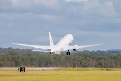 In this photo provided by the Australian Defense Force, a Royal Australian Air Force P-8 Poseidon aircraft departs an airbase in Amberly, Australia, Jan. 17, 2022, to assist the Tonga government after the eruption of an undersea volcano. (LACW Emma Schwenke / Australian Defence Force / AFP)