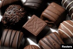 A light almond cream chocolate candy carries the initials for Russell Stover Candies as shown in Kansas City, Kansas, July 14, 2014.