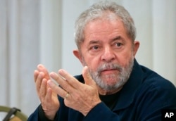 FILE - Brazil's former President Luiz Inacio Lula da Silva attends an extraordinary Worker's Party leaders meeting in Sao Paulo, Brazil, March 30, 2015.