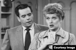 Lucille Ball, right, and Desi Arnaz star as Lucy and Ricky Ricardo in the TV series "I Love Lucy".