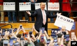 Republican presidential candidate Donald Trump gestures during a rally at Radford University in Radford, Va., Feb. 29, 2016.