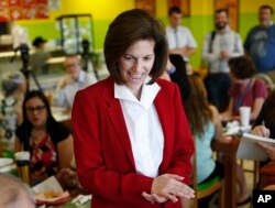 FILE - Nevada Democratic Senate candidate Catherine Cortez Masto meets with people at a campaign event at a restaurant in Las Vegas, May 31, 2016.