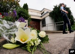 Flowers sit in front of the house of former German Chancellor Helmut Kohl in Oggersheim, Germany, June 16, 2017.