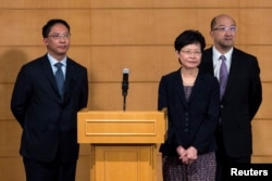 Hong Kong&#39;s Secretary for Justice Rimsky Yuen (L-R), Chief Secretary for Administration Carrie Lam, Secretary for Constitutional and Mainland Affairs Raymond Tam attend a news conference after meeting with the Hong Kong Federation of Students (HKFS).