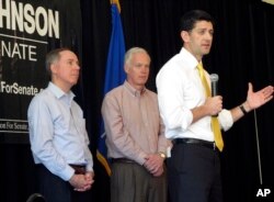 House Speaker Paul Ryan joins Wisconsin state Assembly Speaker Robin Vos, left, and Sen. Ron Johnson, R-Wis., center, at a campaign rally for Johnson in Burlington, Wis., May 5, 2016.