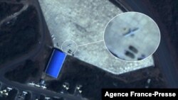 This handout satellite image taken Dec. 9, 2021, by Planet Labs PBC shows what Dutch peace organization PAX says is a Turkish Bayrakter TB-2 drone parked outside a hangar at the northern part of Hara Meda airbase in Bishoftu, Ethiopia. (Planet Labs PBC/AFP)