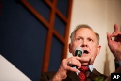 FILE - In this Aug. 15, 2017 file photo, former Alabama Chief Justice and U.S. Senate candidate Roy Moore speaks to supporters in Montgomery, Alabama.