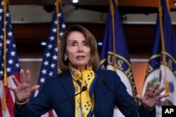 Speaker of the House Nancy Pelosi, D-Calif., talks to reporters at the Capitol in Washington, Jan. 24, 2019.