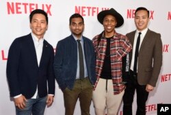 Aziz Ansari, second from left, the star, writer, director and co-creator of the Netflix series "Master of None," poses with cast members, Kelvin Yu, left, and Lena Waithe, second right, and co-creator/executive producer Alan Yang, right, at a screening of of the show at The Paley Center, May 18, 2016, in Beverly Hills, California.