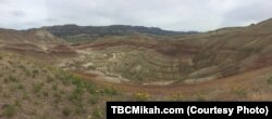 Red stripes paint the hills in the John Day Fossil Beds National Monument in Oregon.