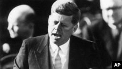 FILE - President John F. Kennedy delivers his inaugural address after taking the oath of office at the Capitol in Washington, D.C., Jan. 20, 1961.