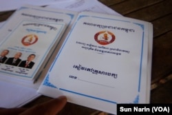 The "CPP family book," right, registers party members in a family, while the "CPP group book," left, assigns members to groups who will monitor each other's party spirit, Nov. 8, 2017.