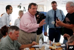 New Jersey Governor Chris Christie, one of 17 Republican presidential candidates, campaigns during a stop at a Greek festival in Manchester, N.H., Aug. 29, 2015.