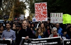 Protesters demonstrate near Pittsburgh's Tree of Life Synagogue where President Donald Trump and first lady Melania Trump were visiting a memorial in Pittsburgh, Oct. 30, 2018.