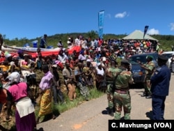 People in Chimanimani complain, March 22, 2019, to senior army officials in charge of a temporary camp set up after Cyclone Idai that food is not reaching them.