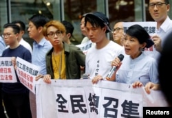 Pro-democracy legislator Claudia Mo speaks during a protest outside the Legislative Council building in Hong Kong, June 11, 2019.