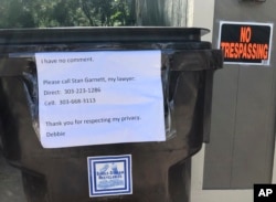 FILE - A sign requesting privacy and stating she has no comment is posted outside the home of Deborah Ramirez in Boulder, Colo., Sept. 24, 2018.