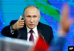 Russian President Vladimir gestures during his annual news conference in Moscow, Russia, Dec. 20, 2018.
