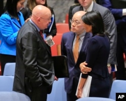 FILE - United Nations Ambassadors Vasily Nebenzya of Russia, left, Liu Jieyi of China, center, and Nikki Haley of the U.S., right, confer after the United Nations nonproliferation meeting on North Korea, Sept. 4, 2017 at U.N. headquarters.