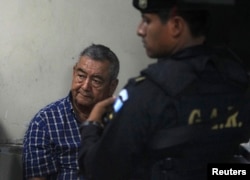 FILE - Suspect Waldemar Lorenzana Lima (L) sits after his arrest in Guatemala City, April 26, 2011.