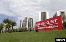 FILE - A sign of the Odebrecht SA construction conglomerate is pictured in Rio de Janeiro, Brazil, Feb. 26, 2016.