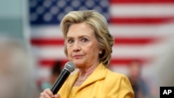 FILE - Democratic presidential candidate Hillary Rodham Clinton listens to questions during a campaign stop, July 28, 2015, in Nashua, N.H