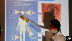 Colombia's Health Minister Alejandro Gaviria explains the symptoms of Zika during an event to launch a nationwide prevention campaign against the virus in Ibague, Colombia, Jan. 26, 2016.