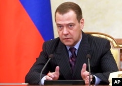 FILE - Russian Prime Minister Dmitry Medvedev speaks during a cabinet meeting in Moscow, Russia, Dec. 7, 2017.