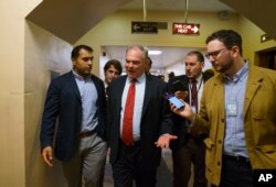FILE - Sen. Tim Kaine (Democrat-Virginia) speaks to reporters on Capitol Hill in Washington, Sept. 25, 2018.