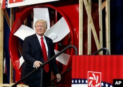 President Donald Trump arrives to speak about tax reform at the Loren Cook Company in Springfield, Missouri, Aug. 30, 2017.