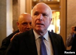 U.S. Senator John McCain (R-AZ) leaves after Senator Dianne Feinstein's (D-CA) speech on the Senate floor on Capitol Hill, in Washington, Dec. 9, 2014.
