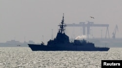 FILE - Spanish navy frigate Mendez Nunez arrives at Spain's Rota naval port, March 22, 2011.