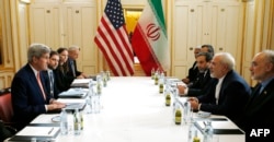 US Secretary of State John Kerry (L) meets with Iranian Foreign Minister Javad Zarif (2R) in Vienna, Austria on Jan. 16, 2016.