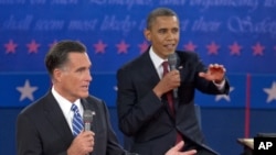 President Barack Obama, right, and Republican presidential candidate Mitt Romney participate in the presidential debate, October 16, 2012, at Hofstra University in Hempstead, New York.