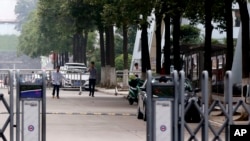 People walk inside the factory of Ganzhou Huajian International Shoe City Co., which has made shoes for the Ivanka Trump brand, in Ganzhou in southern China's Jiangxi province, June 18, 2017.