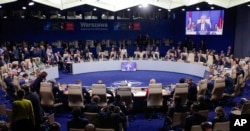 State leaders attend a working session at the NATO summit in Warsaw, Poland, Saturday, July 9, 2016.