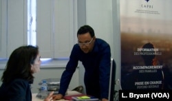 Imam Fouad Saanadi talks to a member of CAPRI's team.