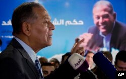 FILE - Mohammed Anwar Sadat, nephew of Egypt's late leader Anwar Sadat and the leader of Reform and Development Party, speaks during a press conference at the party headquarters, in Cairo, Egypt, Jan. 15, 2018. Egyptian President Abdel-Fattah el-Sissi ran virtually unopposed in that week's elections after a series of potentially serious candidates were arrested or withdrew from the race under pressure. Sadat said he quit the race because the climate was not conducive for campaigning and because he feared for the safety of his supporters.