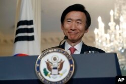 South Korean Foreign Minister Yun Byung-se smiles after meeting with Secretary of State John Kerry, Oct. 19, 2016, at the State Department in Washington.