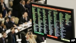 A digital display shows the results of a vote on a resolution upholding the territorial integrity of Ukraine at United Nations headquarters, March 27, 2014.