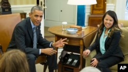 President Barack Obama meets with Ebola survivor Nina Pham, White House, Oct. 24, 2014.