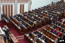 FILE - Ethiopian lawmakers attend a swearing-in ceremony of newly appointed ministers at the Parliament in the capital Addis Ababa, Oct. 16, 2018. Women currently fill half of the country’s cabinet and 37 percent of its legislature.
