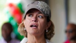 FILE - Boston mayoral candidate Annissa Essaibi George greets people before the start of the Roxbury Unity Parade, in Boston's Roxbury neighborhood, July 18, 2021.
