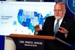 FILE - Dr. Robert Redfield, director of the Centers for Disease Control and Prevention, speaks about the coronavirus in the James Brady Press Briefing Room of the White House, Friday, April 17, 2020, in Washington. (AP Photo/Alex Brandon)