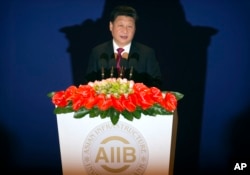 Chinese President Xi Jinping speaks during the opening ceremony of the Asian Infrastructure Investment Bank (AIIB) in Beijing Saturday, Jan. 16, 2016.