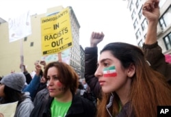 FILE - Thousands of people take part in the "Free the People Immigration March,'' to protest actions taken by President Donald Trump and his administration, in Los Angeles, Feb. 18, 2017.