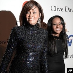 Whitney Houston and daughter Bobbi Kristina in Beverly Hills, CA, February 12, 2011