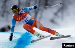 Norway's Kjetil Jansrud skis in the men's alpine skiing downhill race during the 2014 Sochi Winter Olympics at the Rosa Khutor Alpine Center, Feb. 9, 2014.